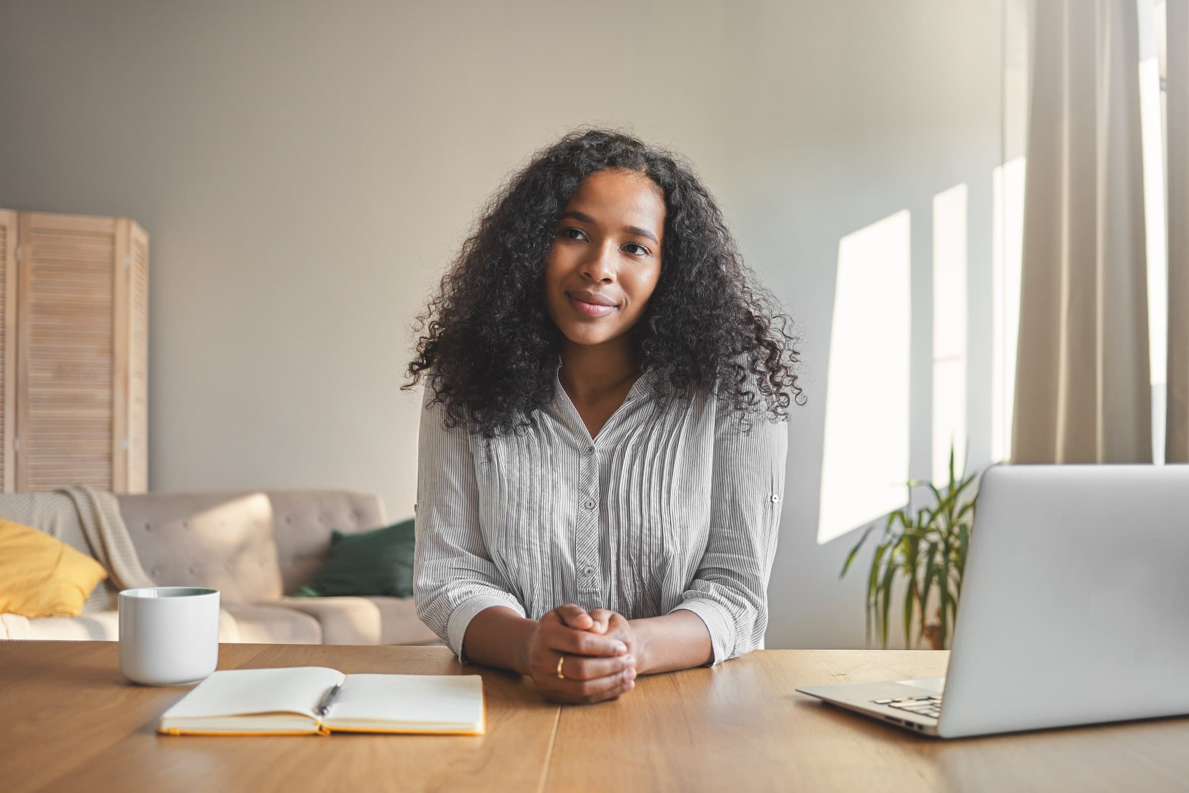 Amara at her desk at home
